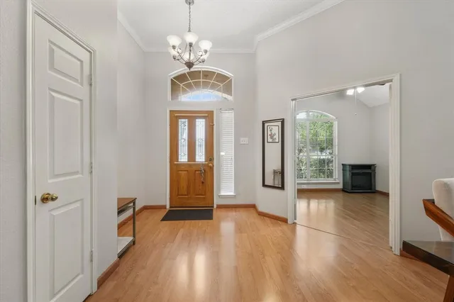 a view of livingroom with kitchen and hardwood