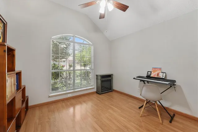 a workspace with furniture hardwood and a window