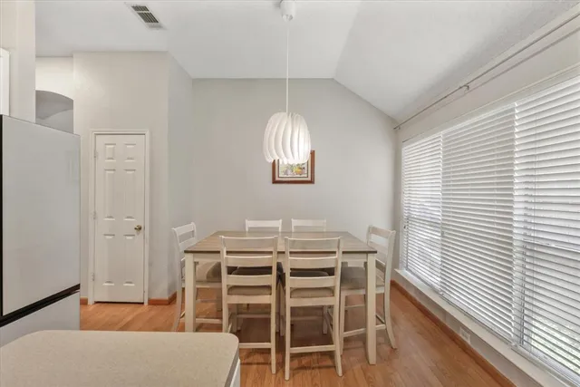 a dining room with furniture and window