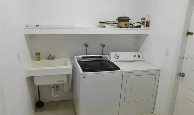 a utility room with dryer and washer