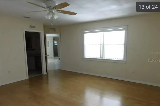 a view of an empty room with a window