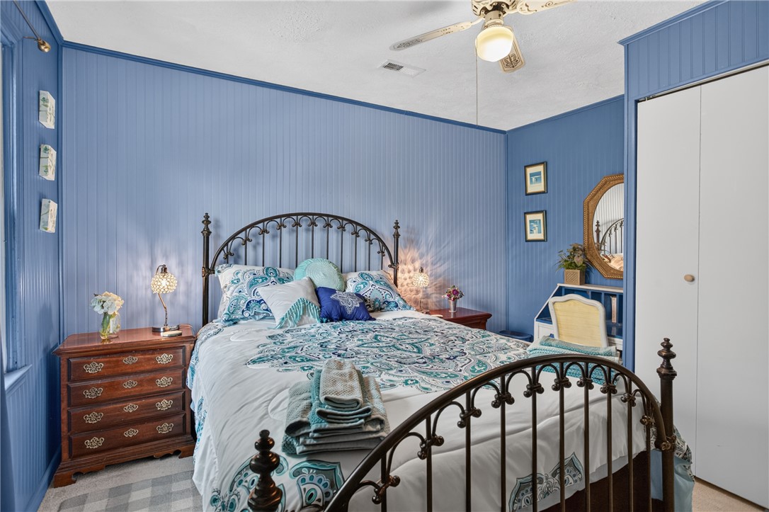 351 River Road Westminster, SC 29693 - Photo 29 of 50 A comforting bedroom with beadboard accent walls, perfect for peaceful rest.