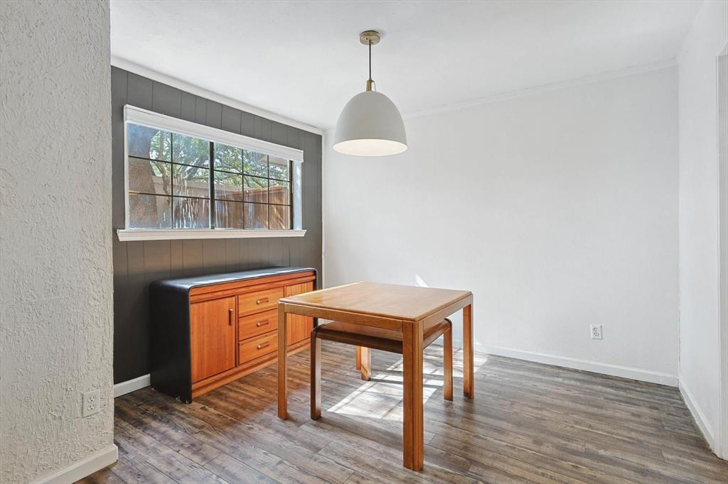 9801 Smokefeather Lane Dallas, TX 75243 - Photo 12 of 27 a dining room with a table and chairs
