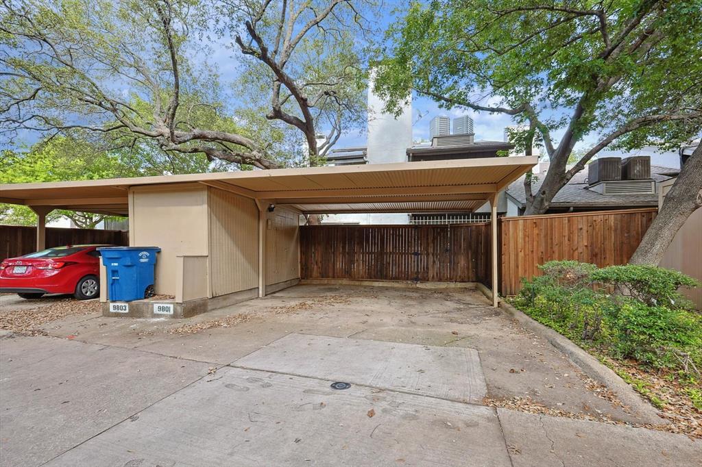 9801 Smokefeather Lane Dallas, TX 75243 - Photo 27 of 27 a front view of a house with parking area