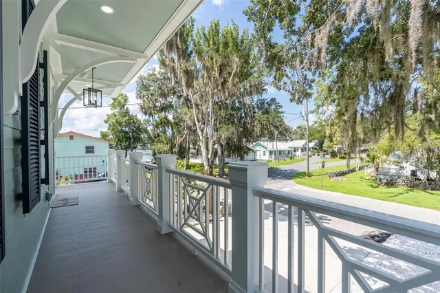 a spacious bedroom with a bed and a window