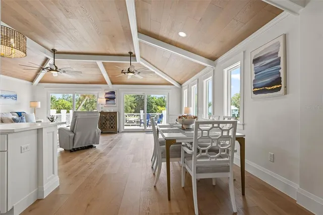 a bedroom with a bed and a ceiling fan