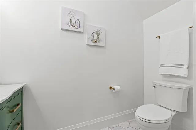 a kitchen with stainless steel appliances granite countertop a refrigerator sink and cabinets