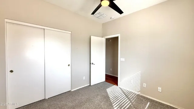 a view of a room with a white wall