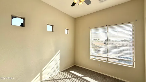 a view of an empty room with a window