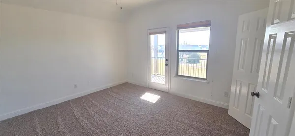 a view of an empty room and window