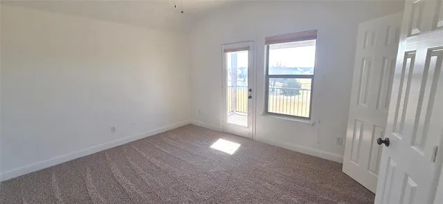 a view of an empty room and window