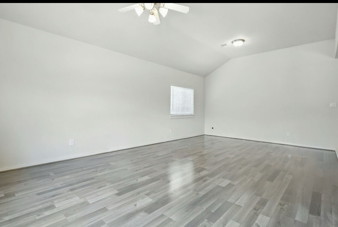 21319 Indigo Ruth Drive Spring, TX 77379 - Photo 15 of 34 a view of an empty room and wooden floor