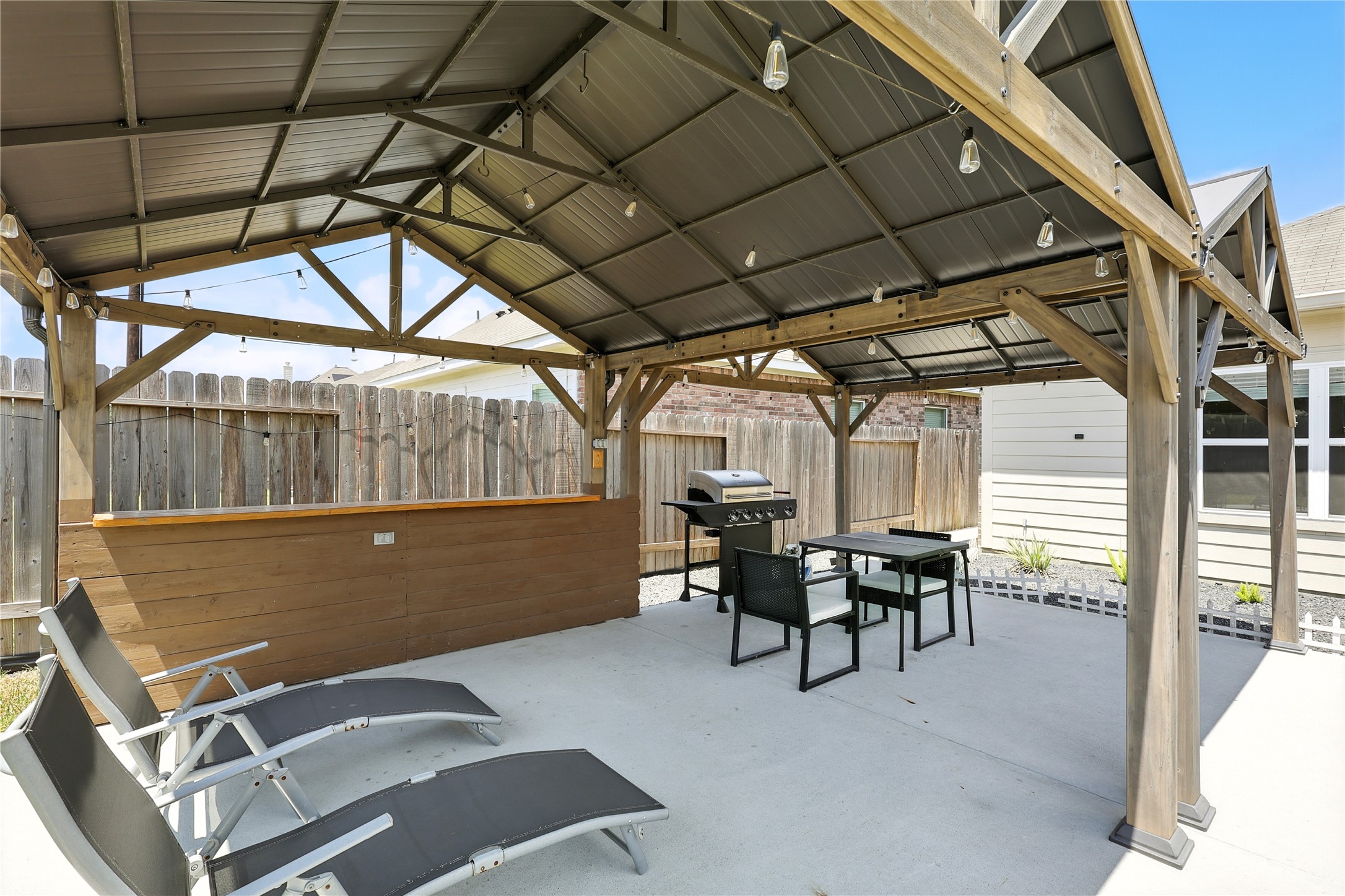 21319 Indigo Ruth Drive Spring, TX 77379 - Photo 24 of 34 a view of a tables and chairs in patio