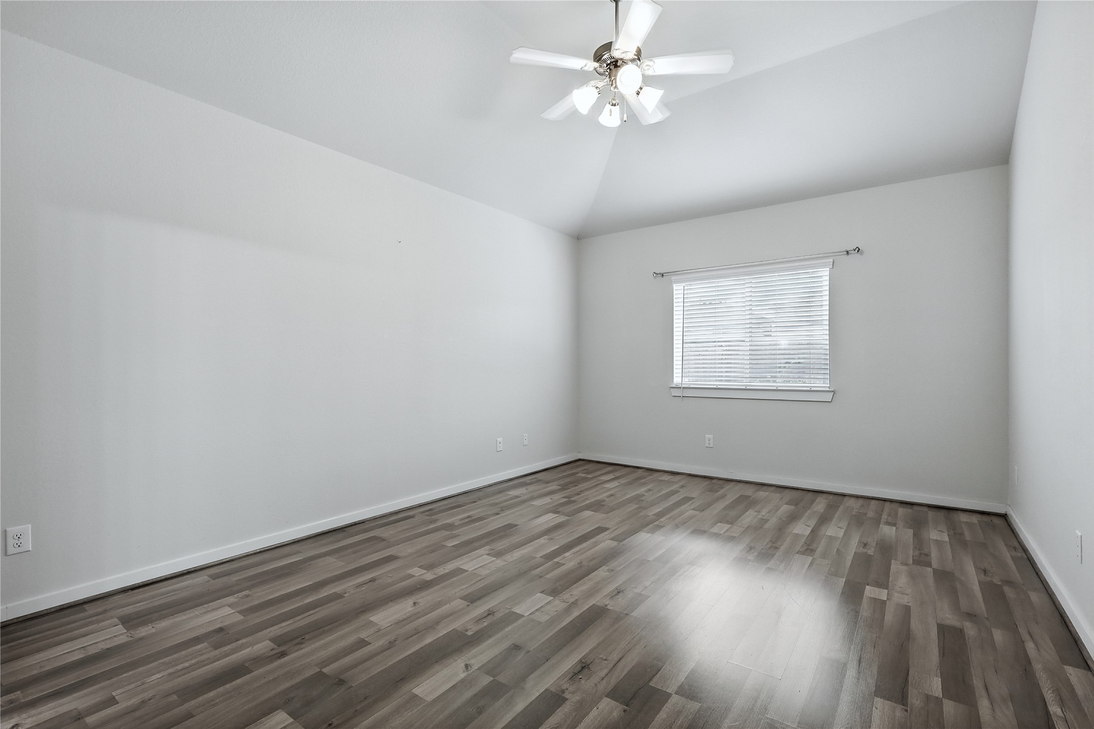 21319 Indigo Ruth Drive Spring, TX 77379 - Photo 4 of 34 a view of empty room with wooden floor and fan