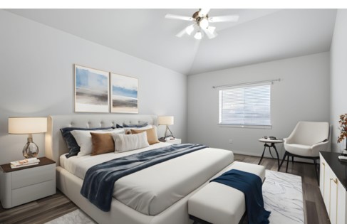 21319 Indigo Ruth Drive Spring, TX 77379 - Photo 5 of 34 a bedroom with a bed and a chandelier