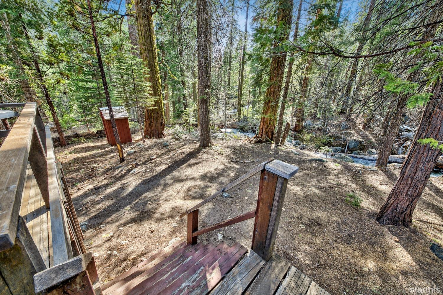 39 Milestone Road, Unit 32 Kyburz, CA 95720 - Photo 16 of 21 a view of a backyard with sitting area