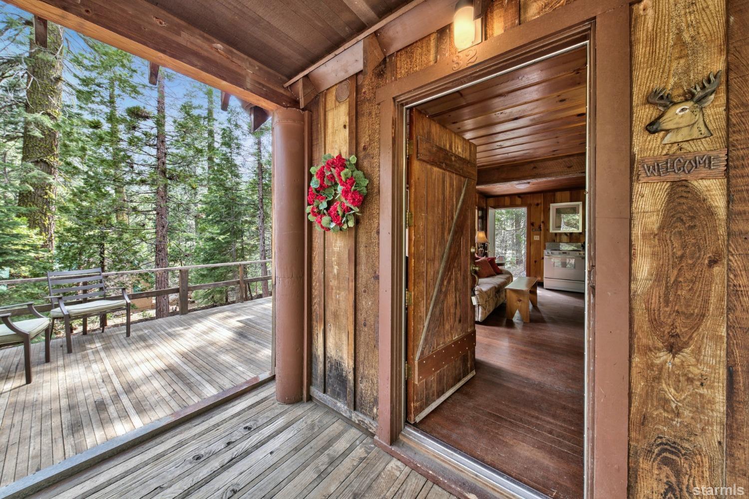39 Milestone Road, Unit 32 Kyburz, CA 95720 - Photo 7 of 21 a view of a porch with wooden floor and furniture