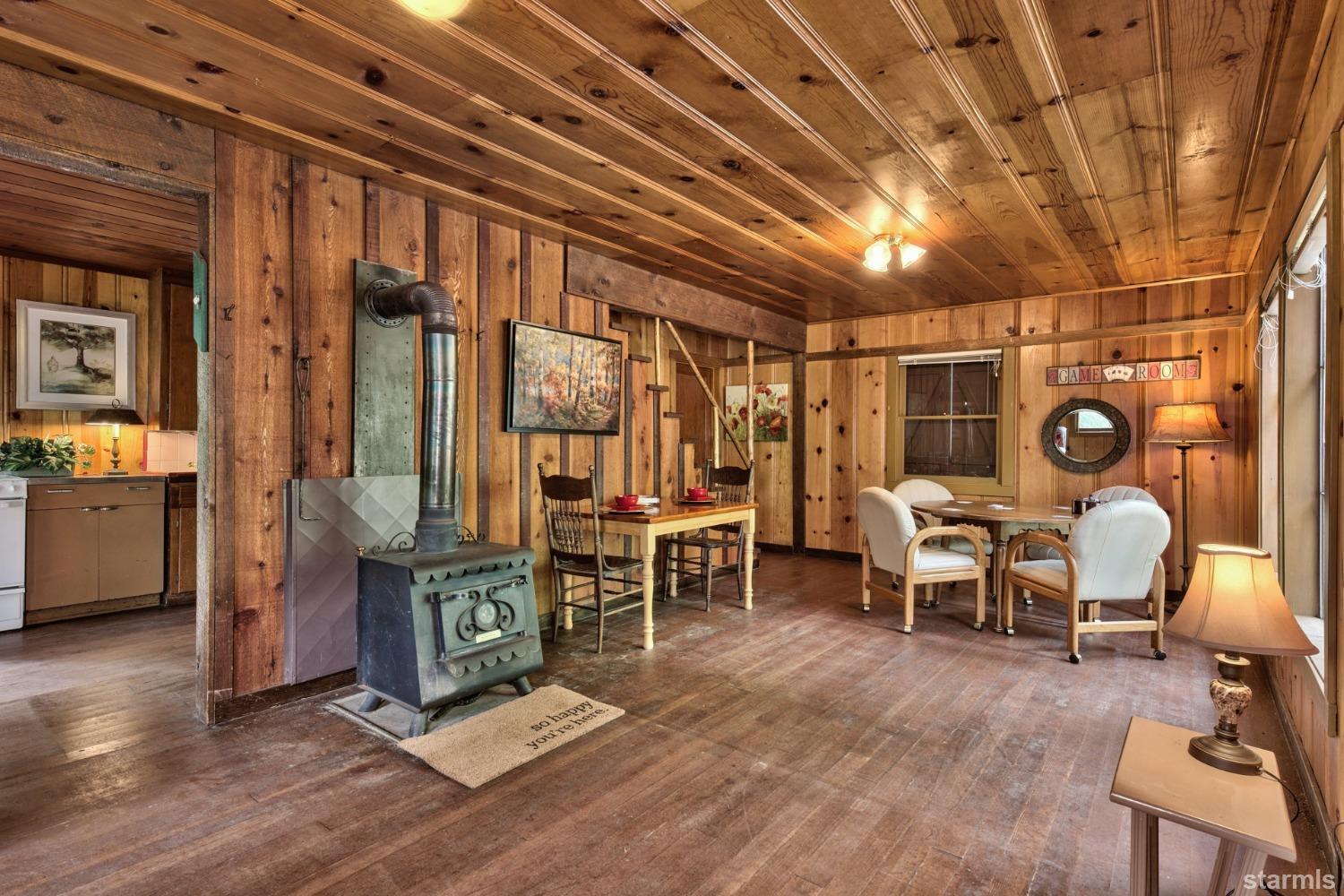39 Milestone Road, Unit 32 Kyburz, CA 95720 - Photo 8 of 21 a living room filled with furniture and a chandelier