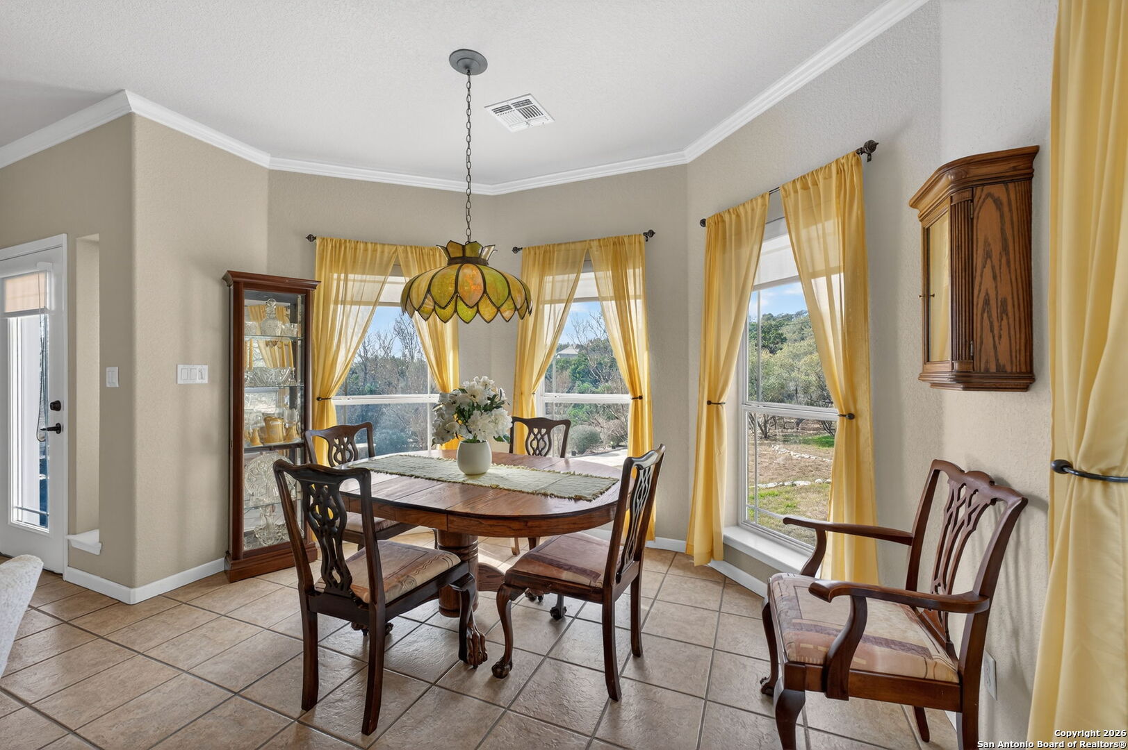 14802 Cross Xd Trail Helotes, TX 78023 - Photo 17 of 58 a view of a dining room with furniture window and outside view