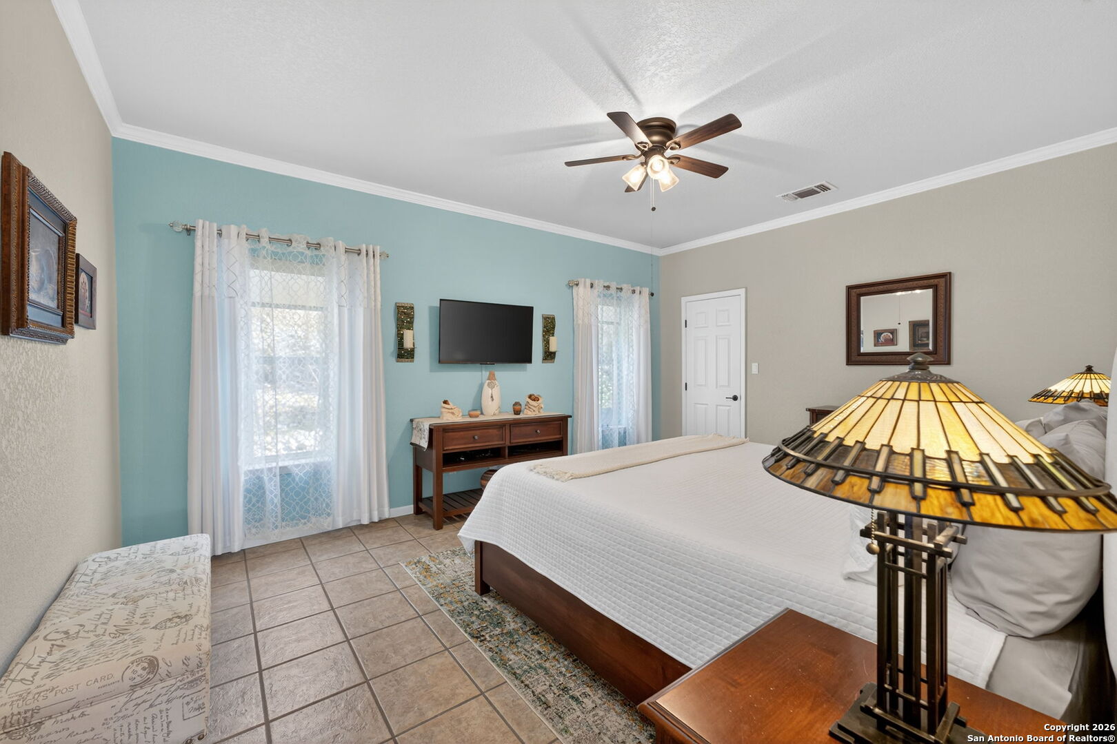 14802 Cross Xd Trail Helotes, TX 78023 - Photo 20 of 58 a bedroom with a bed and a chandelier