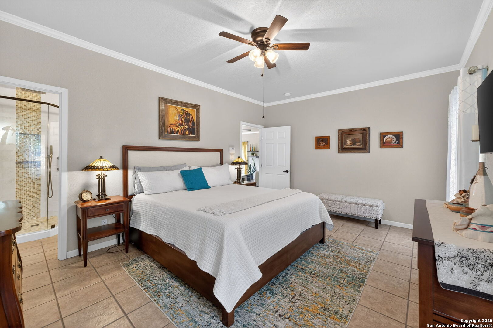 14802 Cross Xd Trail Helotes, TX 78023 - Photo 22 of 58 a bedroom with a bed and a chandelier