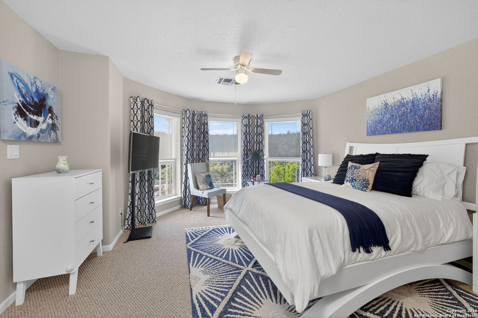 14802 Cross Xd Trail Helotes, TX 78023 - Photo 32 of 58 a bedroom with a large bed and a window