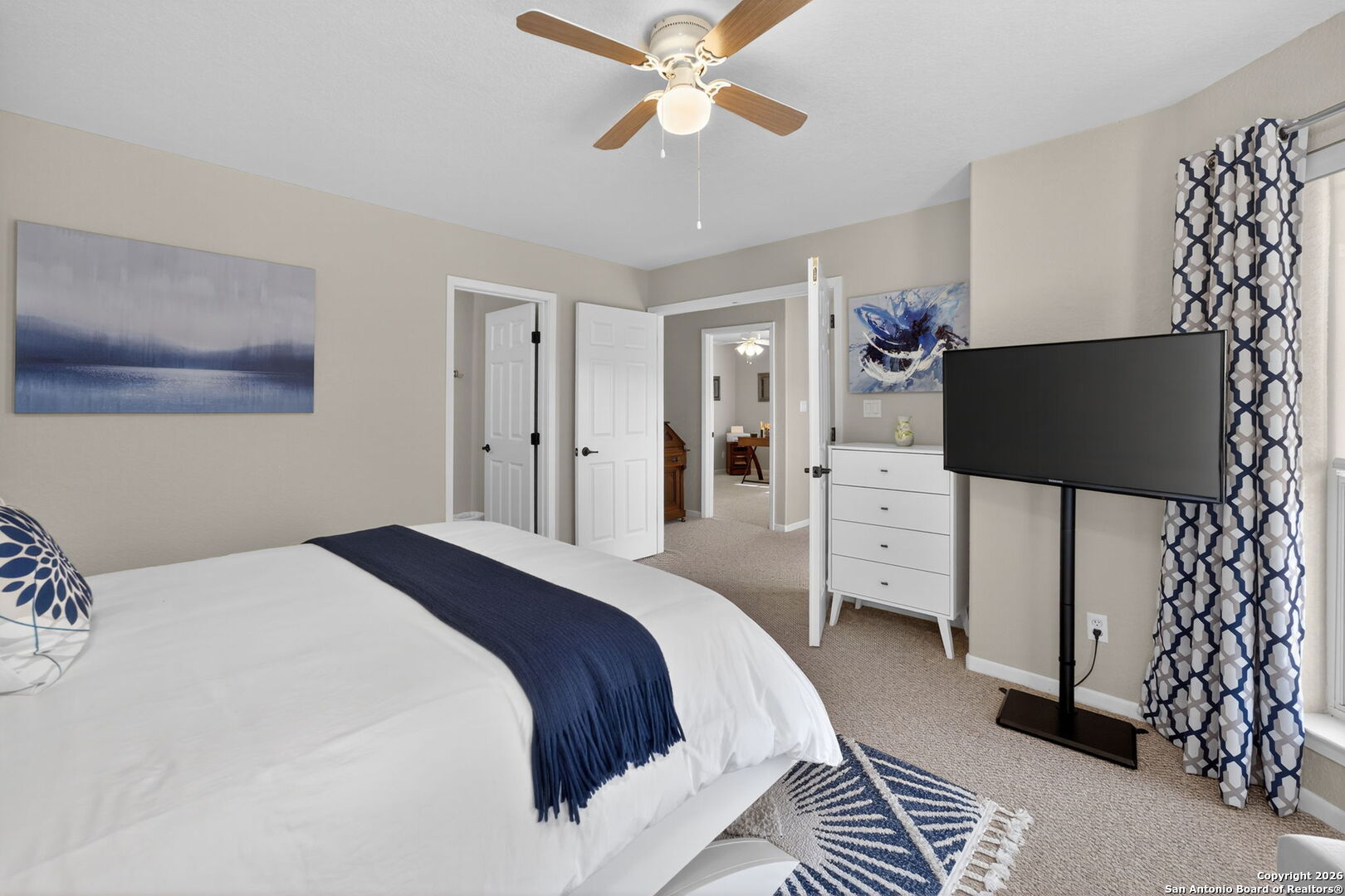 14802 Cross Xd Trail Helotes, TX 78023 - Photo 33 of 58 a bedroom with a bed and a flat screen tv