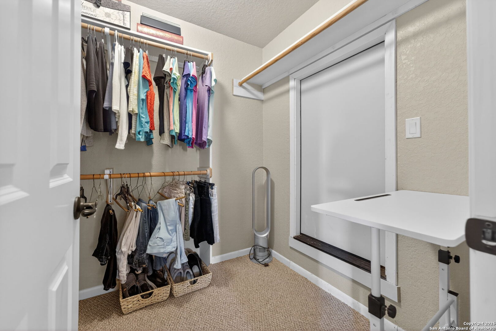 14802 Cross Xd Trail Helotes, TX 78023 - Photo 38 of 58 a view of walk in closet with clothes