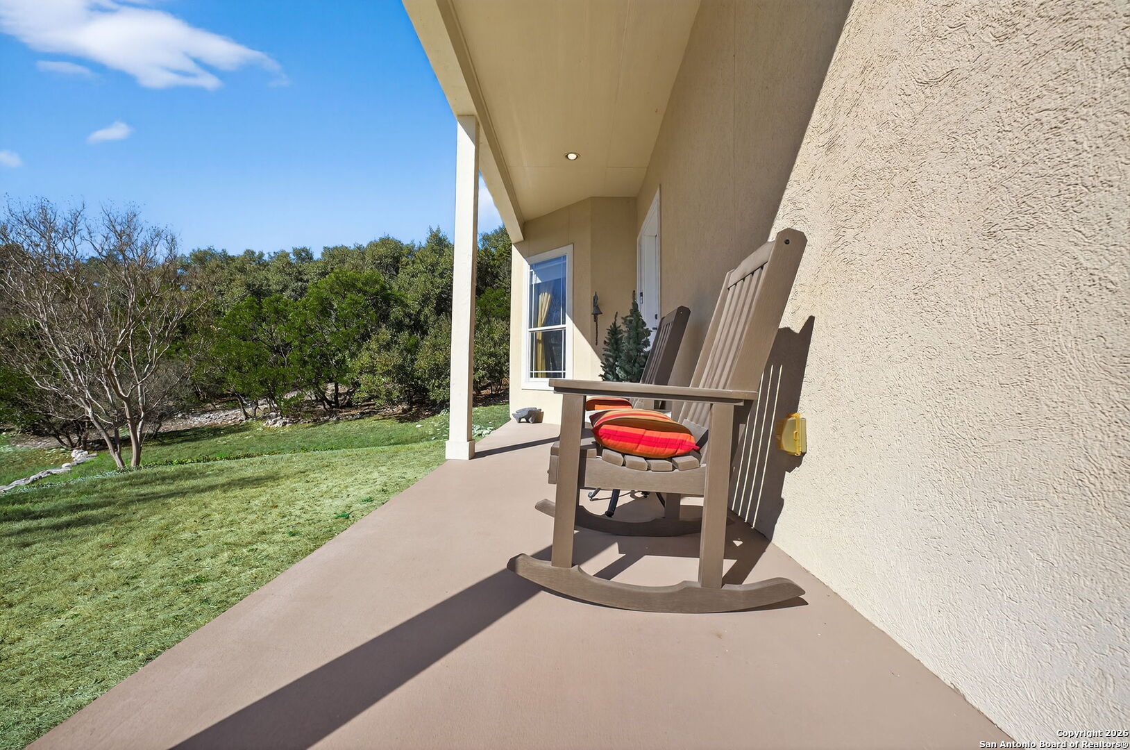 14802 Cross Xd Trail Helotes, TX 78023 - Photo 4 of 58 a view of a two chair and table in the garden