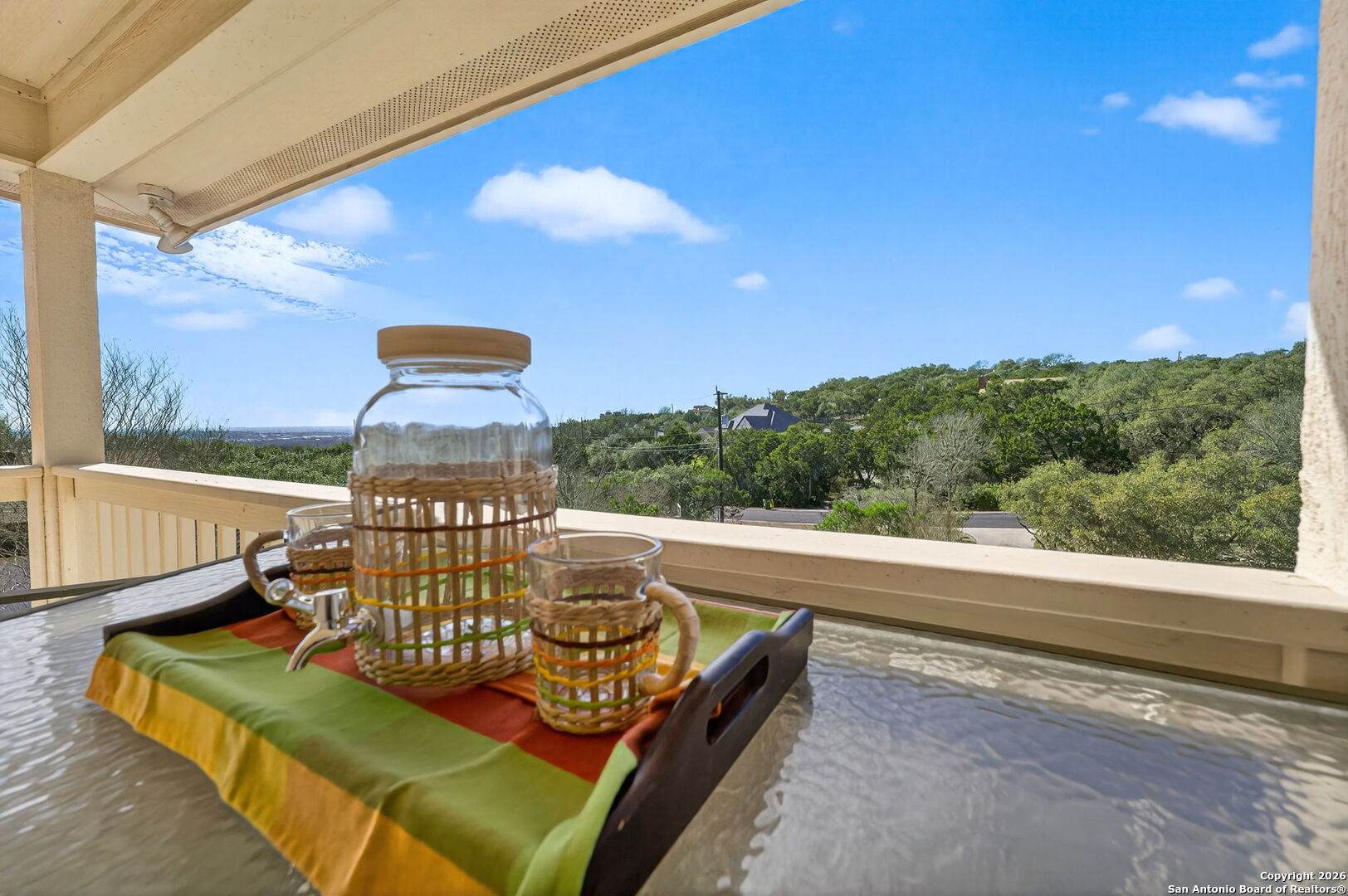 14802 Cross Xd Trail Helotes, TX 78023 - Photo 42 of 58 a view of a chairs and table in the balcony