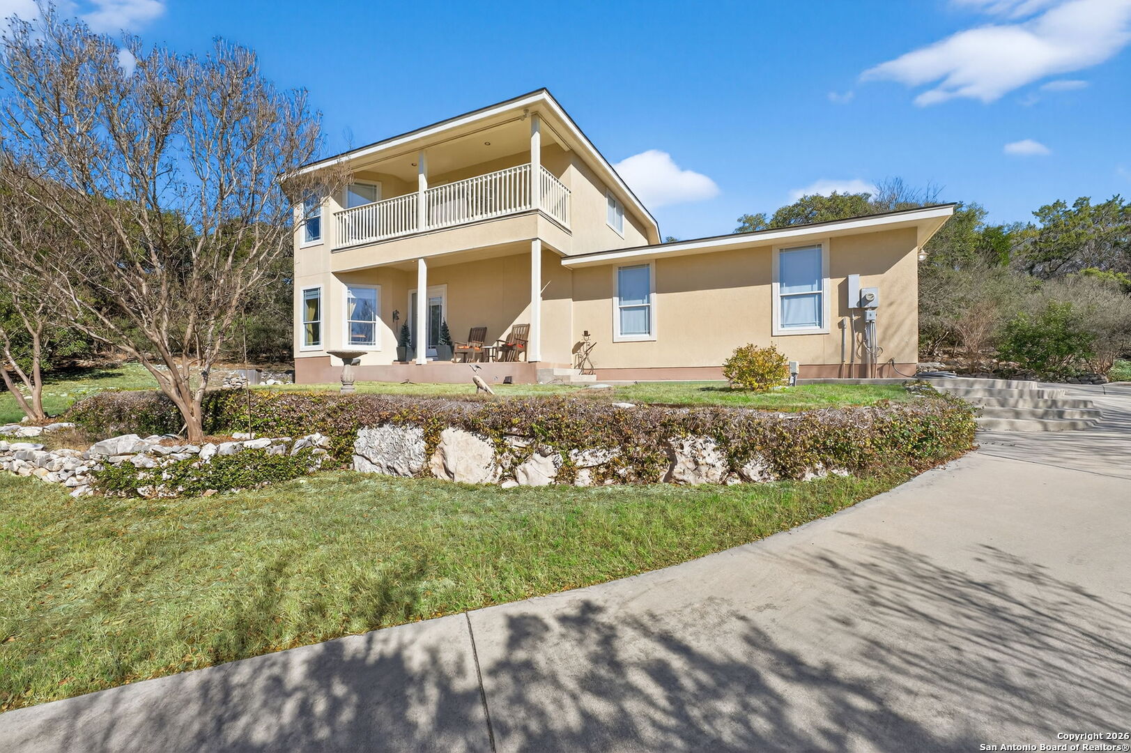 14802 Cross Xd Trail Helotes, TX 78023 - Photo 5 of 58 a front view of a house with a yard