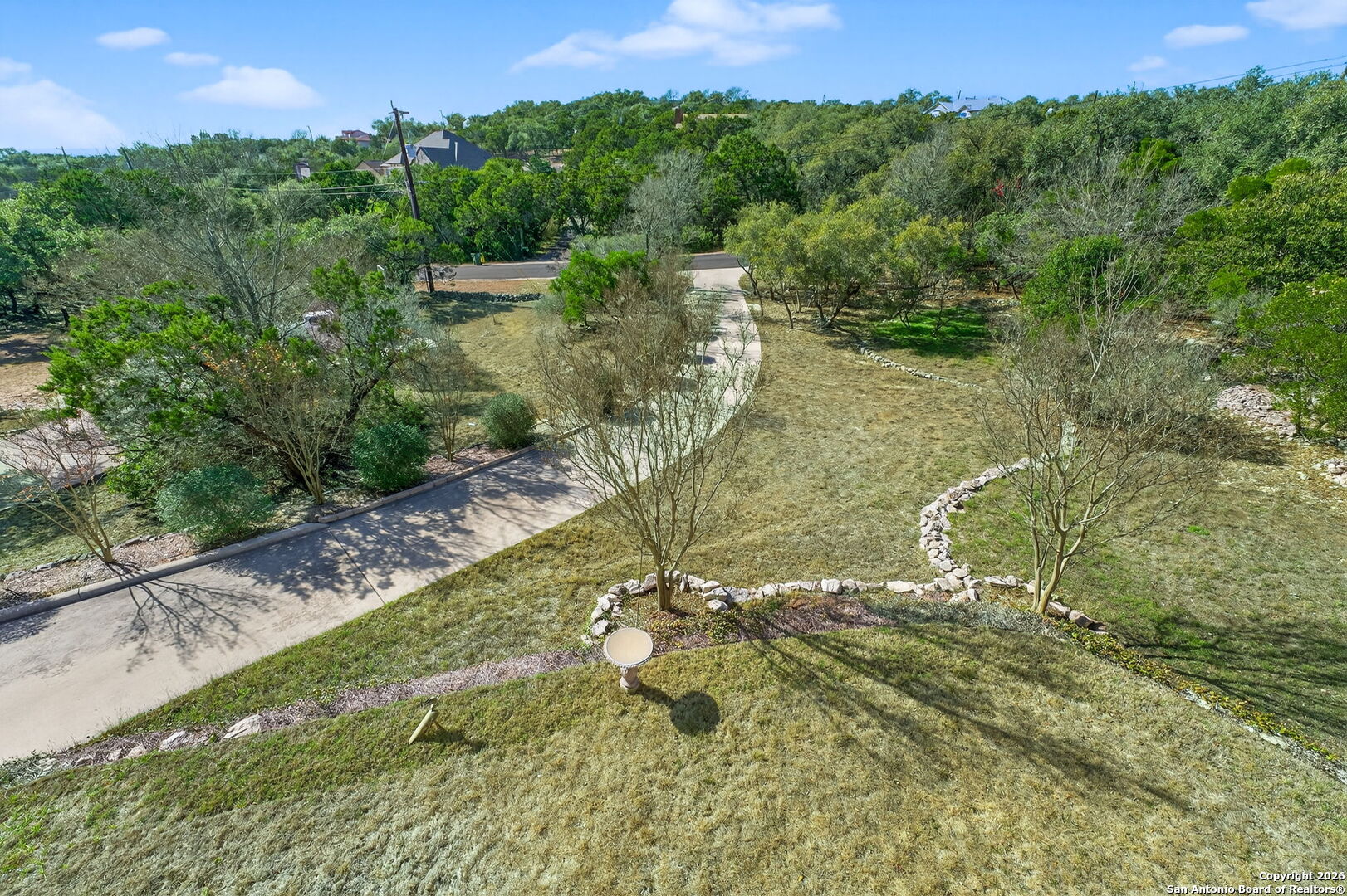 14802 Cross Xd Trail Helotes, TX 78023 - Photo 51 of 58 a view of a lake with a yard