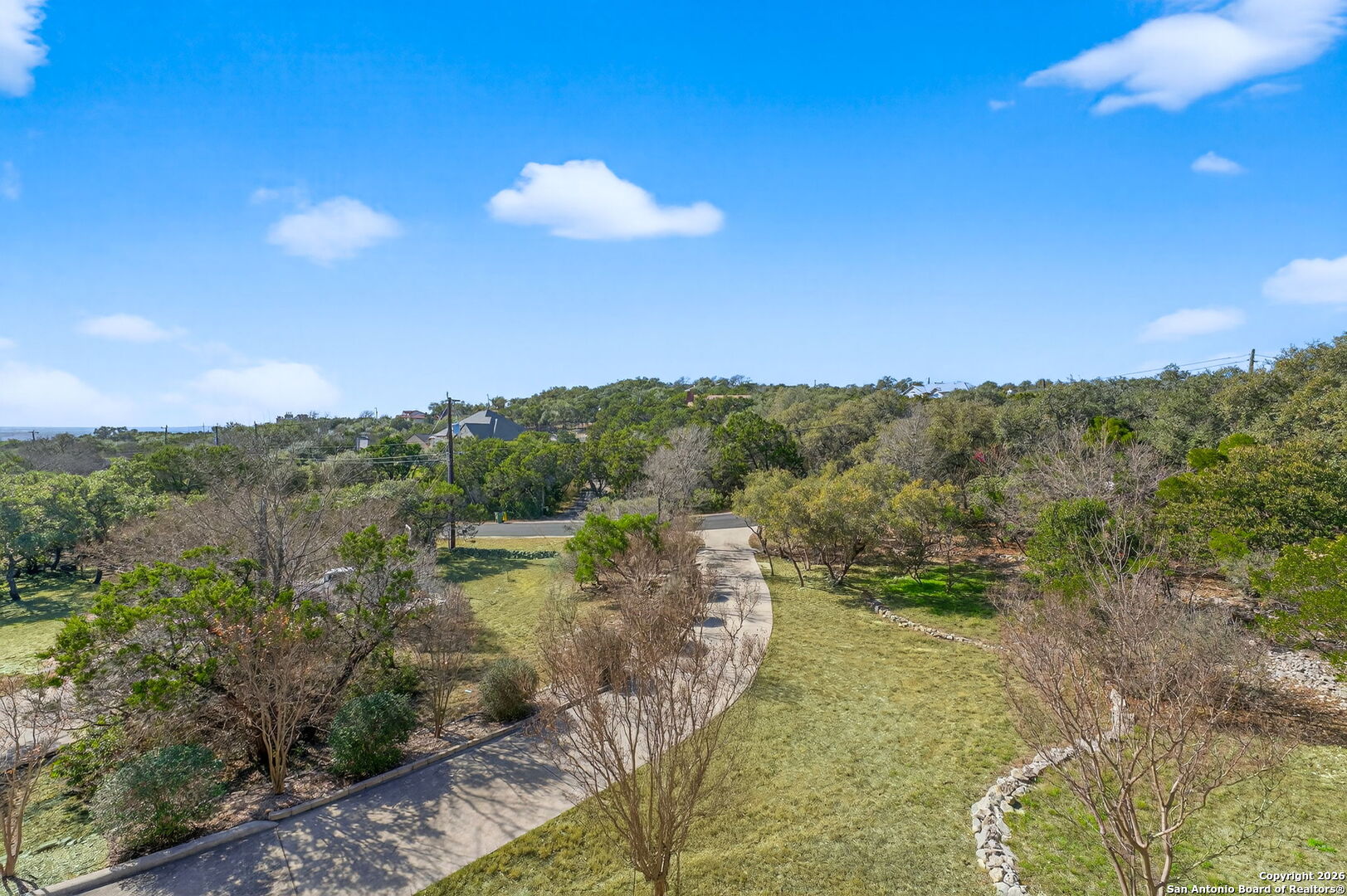14802 Cross Xd Trail Helotes, TX 78023 - Photo 54 of 58 a view of a city with lush green forest