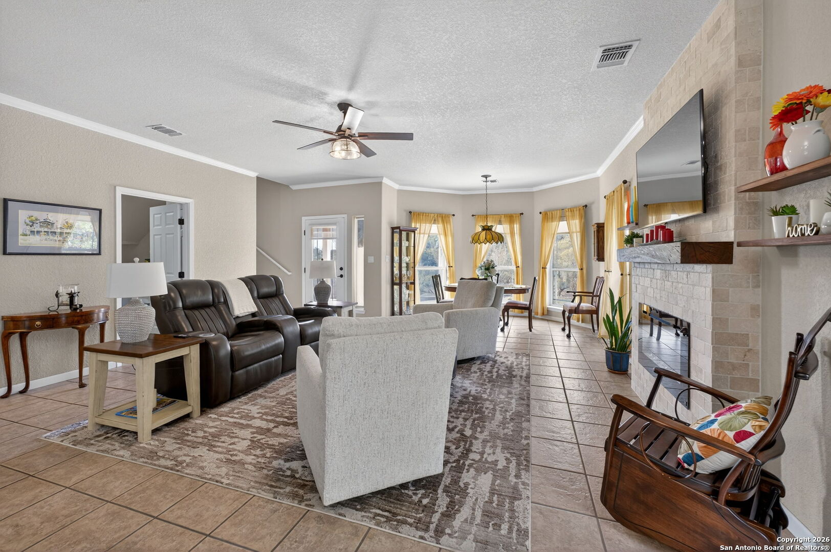 14802 Cross Xd Trail Helotes, TX 78023 - Photo 7 of 58 a living room with fireplace furniture and a window