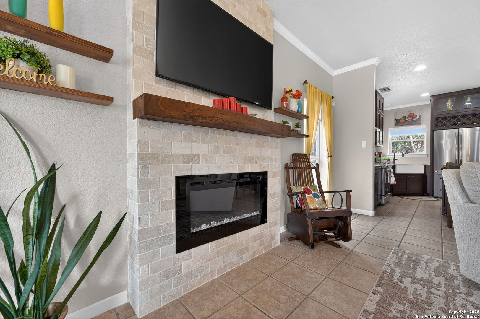 14802 Cross Xd Trail Helotes, TX 78023 - Photo 8 of 58 a living room with furniture a fireplace and a flat screen tv