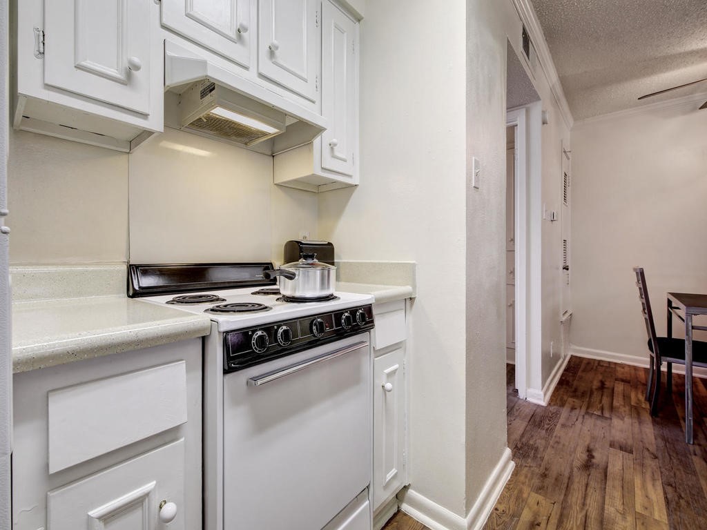 4553 Guadalupe Street, Unit 1BR Austin, TX 78751 - Photo 18 of 31 a white stove top oven sitting inside of a kitchen