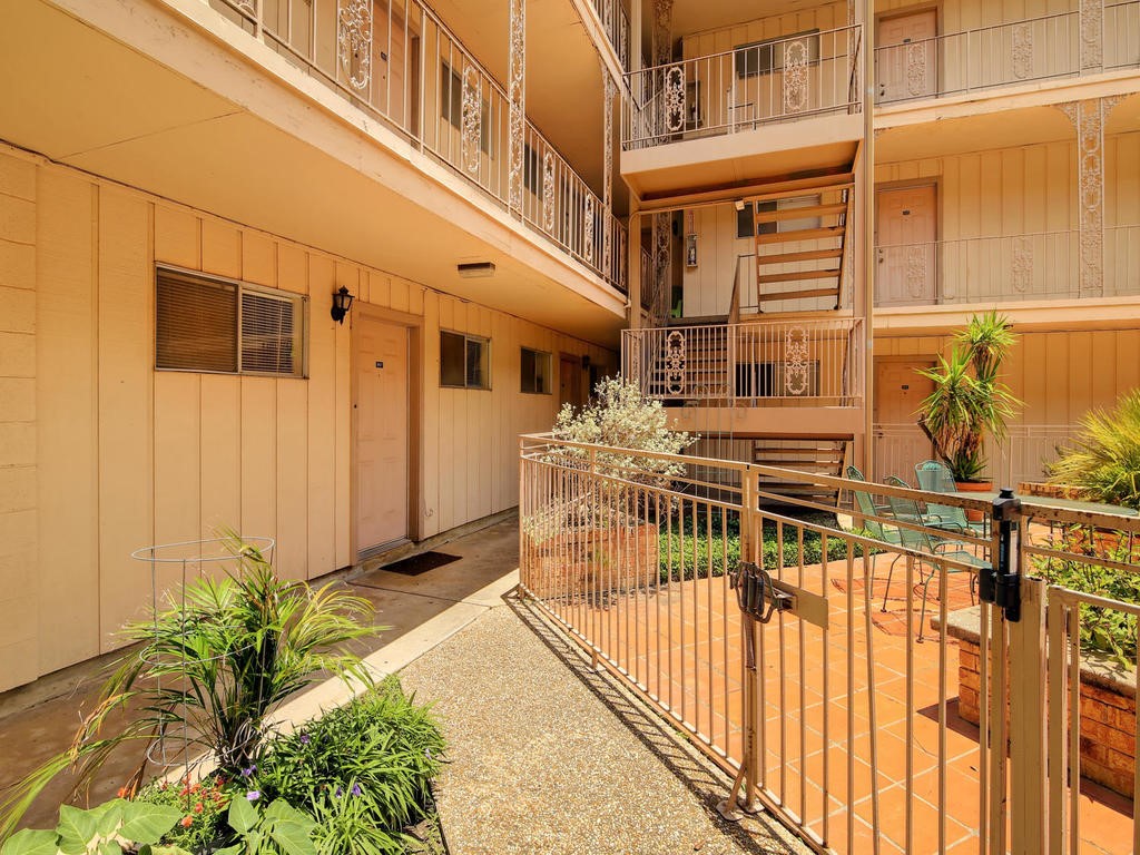 4553 Guadalupe Street, Unit 1BR Austin, TX 78751 - Photo 27 of 31 a view of a building with a glass door