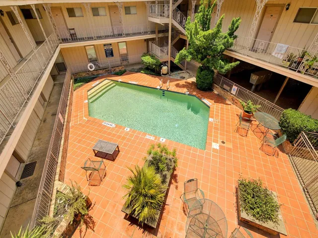 a view of swimming pool with a yard