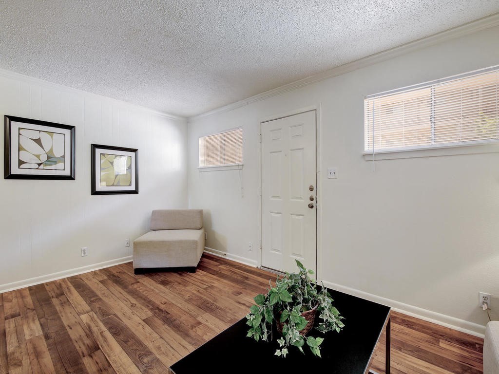 4553 Guadalupe Street, Unit 1BR Austin, TX 78751 - Photo 6 of 31 a living room with furniture and a potted plant