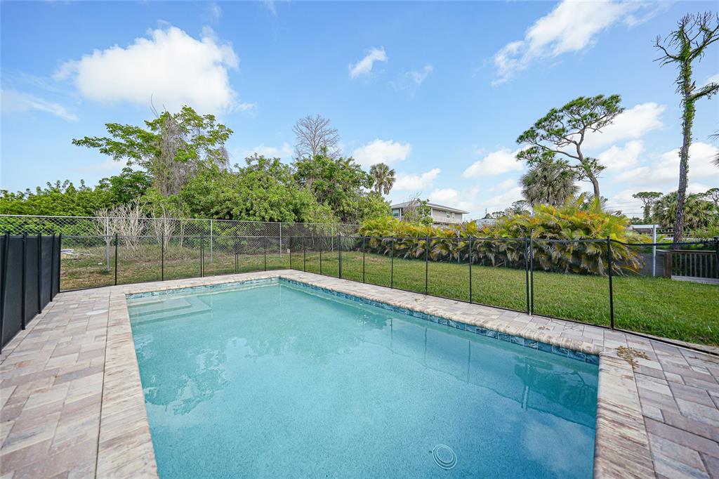 8164 Archie Street Englewood, FL 34224 - Photo 31 of 42 a view of a backyard