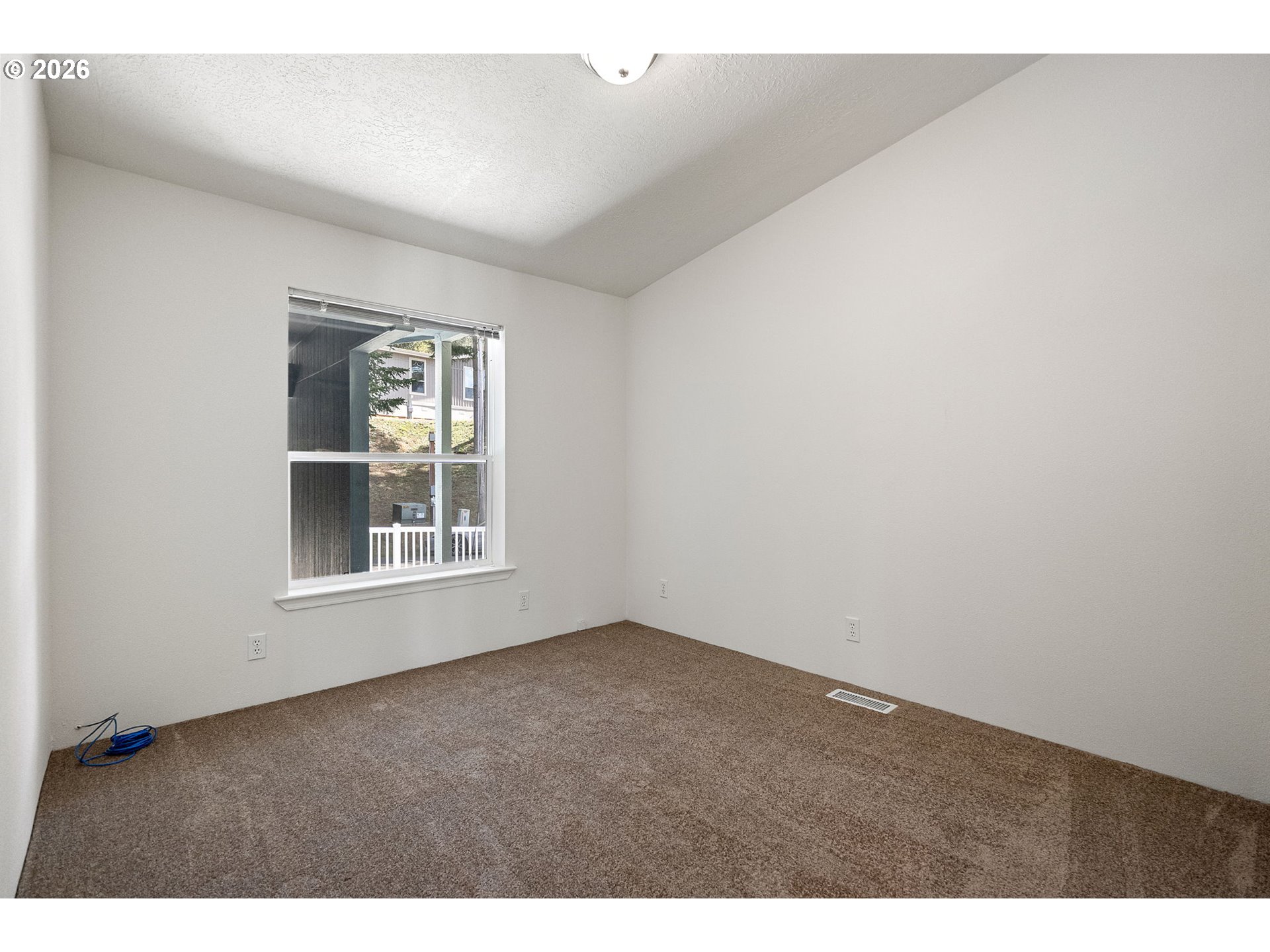 98041 Hallway Road, Unit 41 Brookings, OR 97415 - Photo 30 of 48 an empty room with windows