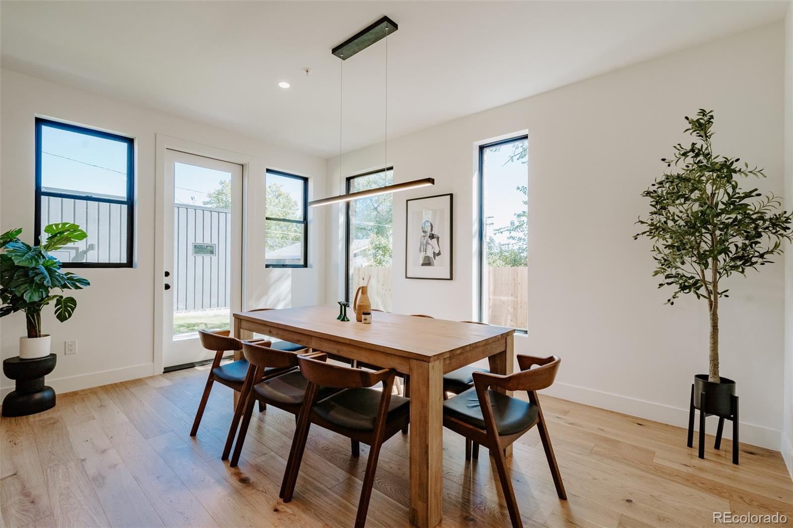 2530 Chase Edgewater, CO 80214 - Photo 11 of 37 a view of a dining room with furniture and wooden floor