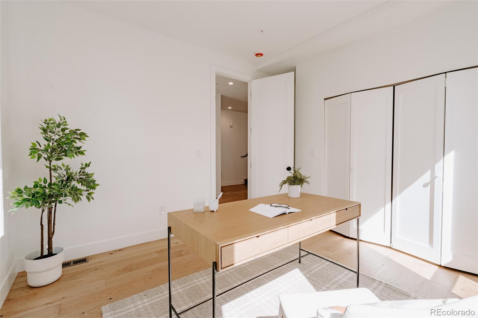 2530 Chase Edgewater, CO 80214 - Photo 20 of 37 a living room with a potted plant