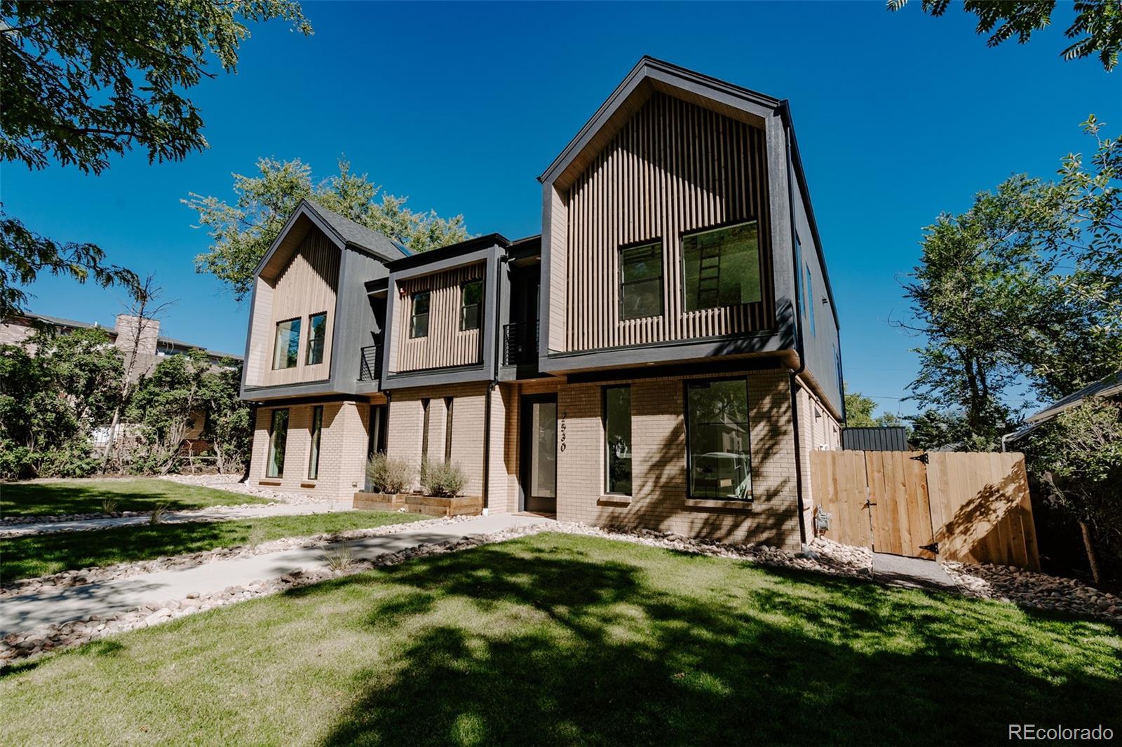 2530 Chase Edgewater, CO 80214 - Photo 2 of 37 a front view of a house with a yard