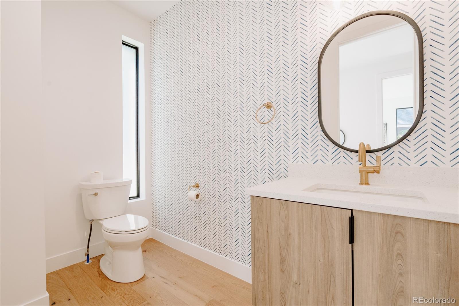 2530 Chase Edgewater, CO 80214 - Photo 22 of 37 a bathroom with a toilet and a sink