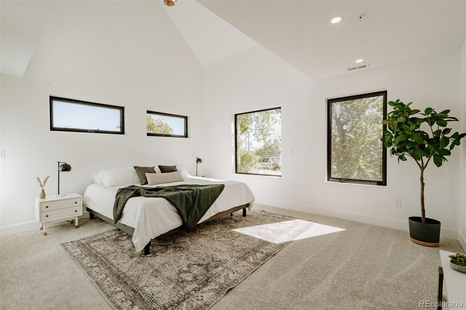 2530 Chase Edgewater, CO 80214 - Photo 27 of 37 a bedroom with a bed and a window
