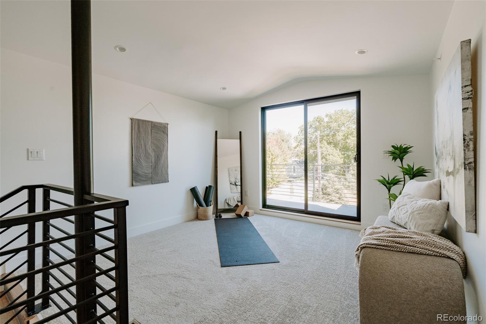 2530 Chase Edgewater, CO 80214 - Photo 32 of 37 a living room with furniture and a window
