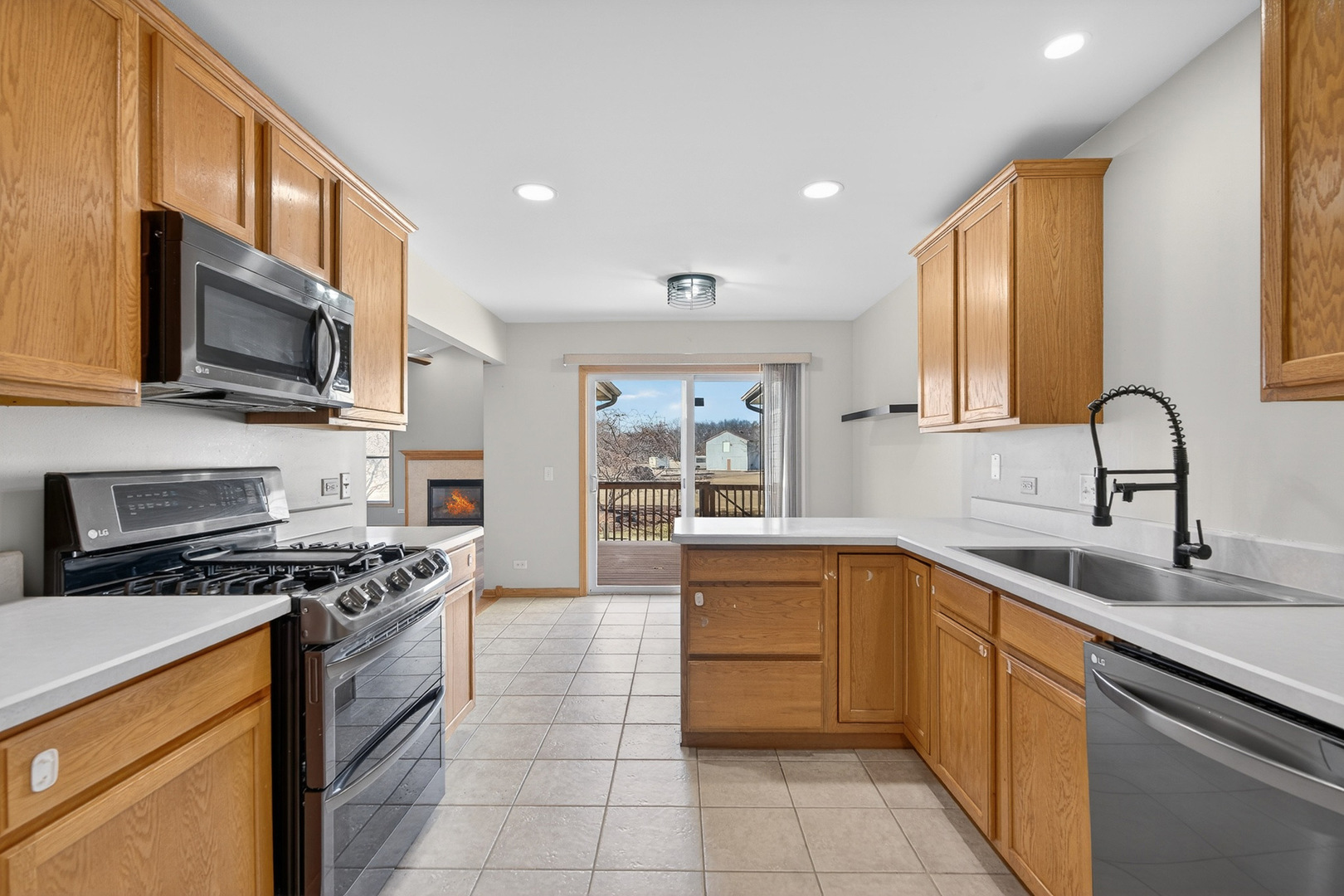 550 Madison Lane Elgin, IL 60123 - Photo 12 of 33 a kitchen with stainless steel appliances granite countertop a stove top oven a sink and dishwasher