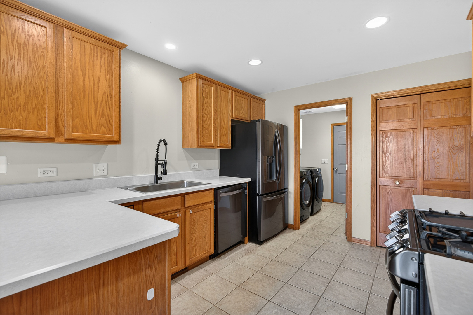 550 Madison Lane Elgin, IL 60123 - Photo 13 of 33 a kitchen with stainless steel appliances granite countertop a refrigerator and a sink