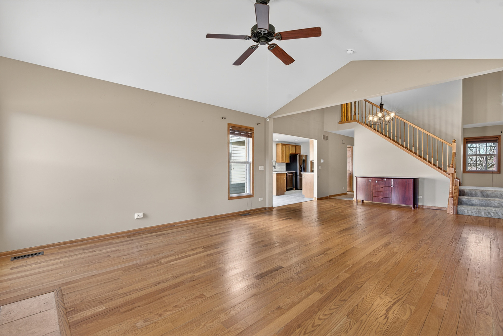 550 Madison Lane Elgin, IL 60123 - Photo 7 of 33 a view of empty room with wooden floor and ceiling fan